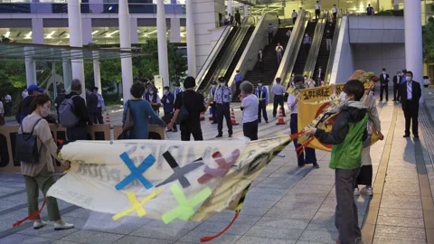 May 28, 2021 - Protest against the 2020/2021 Tokyo Olympics in Tokyo, Japan - 4K Stock Footage 154898590