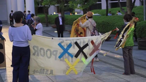 May 28, 2021 - Protest against the 2020/2021 Tokyo Olympics in Tokyo, Japan - 4K Stock Footage 154898632