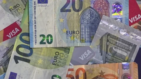 May 28, 2026, Toluca, Mexico, close-up pan of euro bills and Visa cards Stock Footage 336577622