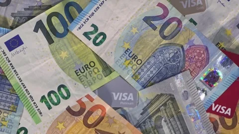 May 28, 2026, Toluca, Mexico, macro tilt down of euro bills and Visa cards Stock Footage 336577656