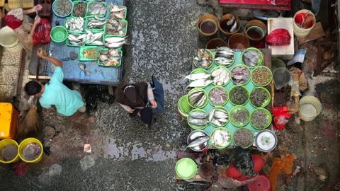 May 4, 2024, Jakarta-High angle view of fish seller at the fish market. Stock Footage 274683556