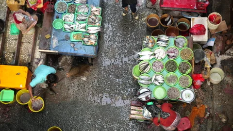May 4, 2024, Jakarta-High angle view of fish seller at the fish market. Stock Footage 274685461