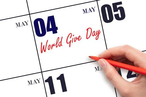 May 4. Hand writing text World Give Day on calendar date. Save the date. Stock Photos