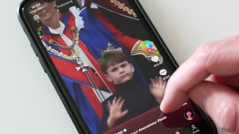 MAY 8, 2023: Using TikTok on an iPhone, Close-up Stock Footage 240641460