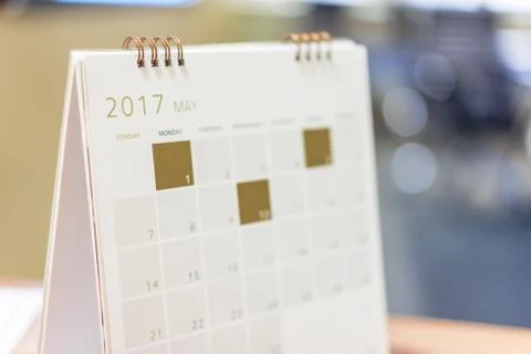 May Calendar placed on the office table. Stock Photos