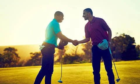 May the course be with you. two golfers shaking hands on the golf course. Stock-Fotos