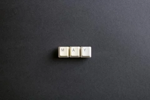 May month word is written with computer keys button on a dark background. Foto stock