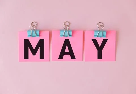 May Text On Pink sticky notes Paper on Pink Background Stock Photos