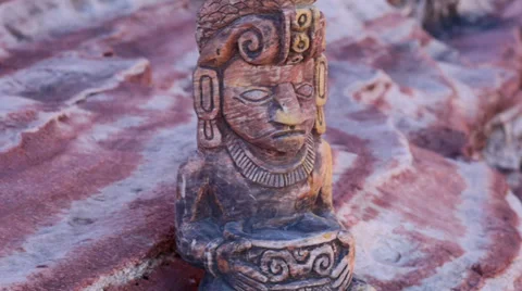 Mayan Statue on Sandstone Ledge Pan Across Stock Footage 35117640