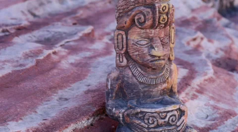 Mayan Statue on a Sandstone Ledge Pan Reveal Stock Footage 35121768