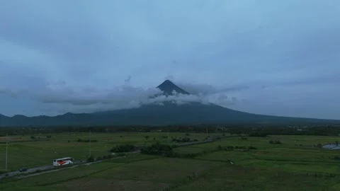 Mayon peak wrapped in clouds.Ideal for tourism and travel Stock Footage 336011379