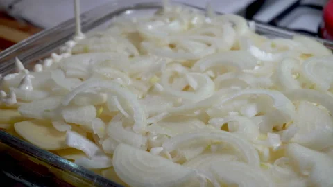 Mayonnaise sauce is poured into baking try Stock Footage 86036762