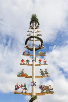 Maypole with illustrations of different crafts Stock Photos
