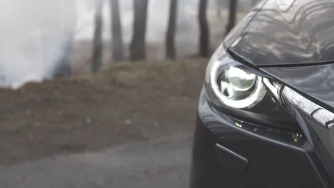 Mazda cx-9 right front light in fog close up shot Stock Footage 88595184