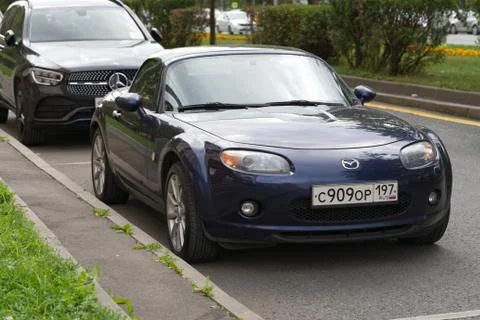Mazda MX-5, is a lightweight two-seater roadster with a front-engine, parked. Stock Photos