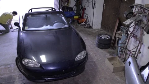 Mazda mx5 miata far high view closed hood Stock Footage 84296884