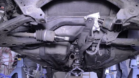 Mazda mx5 miata under car repairing view Stock Footage 84297115