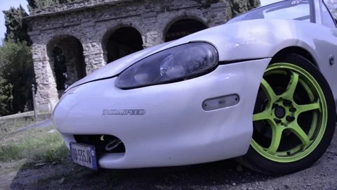 Mazda mx5 miata white front view with sticker Stock Footage 84091744