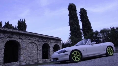 Mazda mx5 miata white front angle low view Stock Footage 84091762