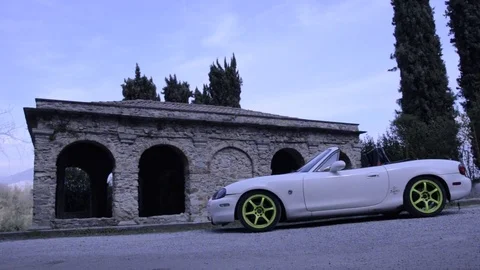 Mazda mx5 miata white lateral far view Stock Footage 84091784