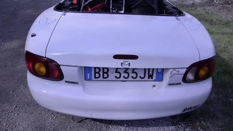 Mazda mx5 miata white rear view low high Stock Footage 84091604