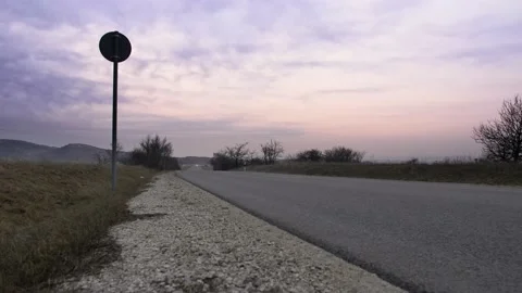 Mazda MX5/Miata car passing by with high speed colorful sunrise clouds Vídeo Stock 201422504