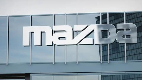 Mazda Stock data presented on the logo of the office facade editorial Stock Photos