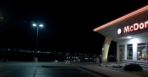 McDonald's Exterior -Pan R to L - Old style - Golden Arches Built Through Facade Stock Footage