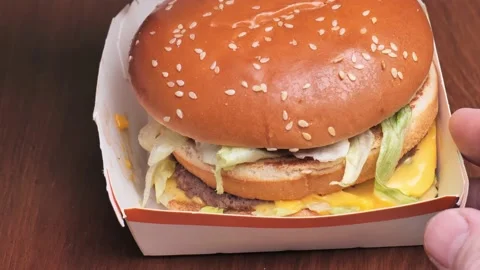 Mcdonalds hamburger opening close-up Stock Footage 221430853