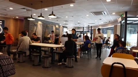 McDonalds. Time lapse. People come, order food, eat and leave. Stock Footage