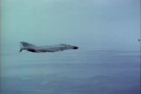 McDonnell Douglas F-4 Phantom II and F-8 Cruiser fire missile - 1968 스톡 동영상 103604160