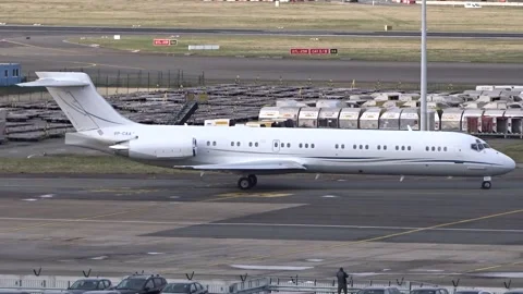Mcdonnell douglas md 87 corporate jet taxiing turning taxiway brussels airport Stock Footage 294051910