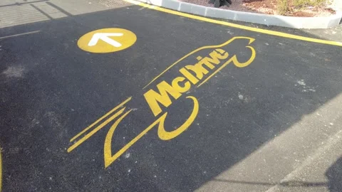 McDrive logo imprinted on the road Stock Footage 332513711