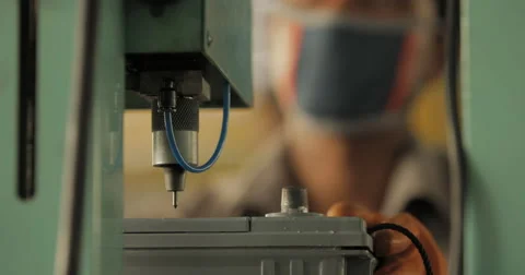 MCU and Rack Focus Shot of Worker Using Industrial Equipment (4K) Stock Footage 60765693
