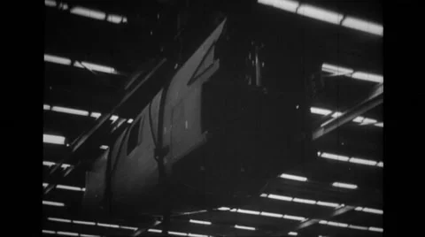 MCU derrick carrying rear section of fuselage of B-24 Liberator Stock Footage 39913819