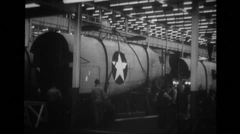 MCU derrick carrying rear section of fuselage of B-24 Liberator Stock Footage 39913833