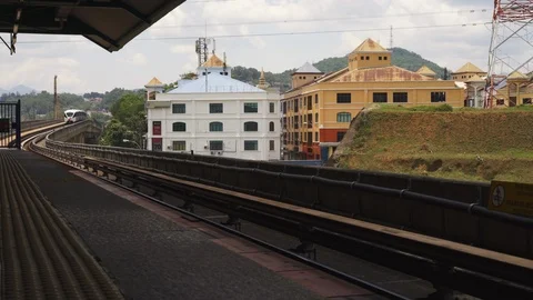 MCU HANDHELD: Train arrives at station in Kuala Lumpur City, Malaysia Stock Footage 109565830