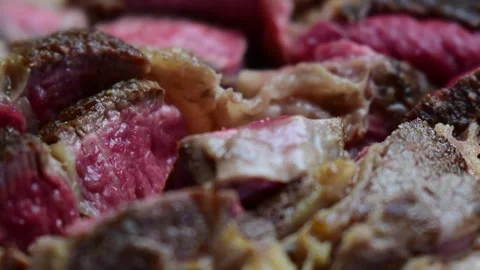 Meadium rare stake cut up close up raw meat Stock Footage 254874496