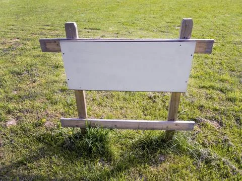 On a meadow is a sign for a building plot for a house for sale. Building site 写真素材