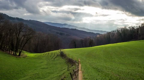 Meadow with valley and cloudy sky timelapse Stock-Footage 45728137