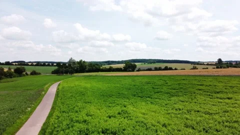 Meadows and endless fields near the village Stock Footage 161066269