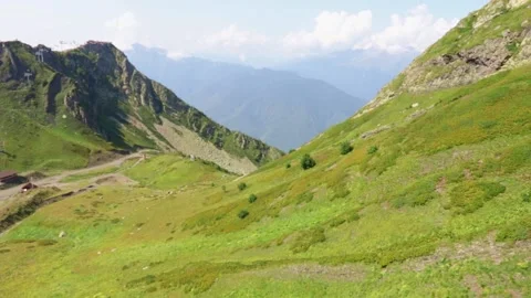 Meadows and fields. Mountain landscape with green grass and sky. Stock Footage 166350048