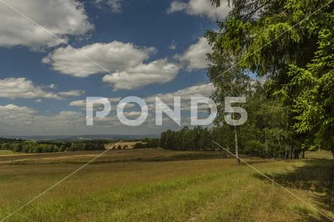 Meadows and pasture land near vanished village Smrkovec in summer hot day Stock Photos