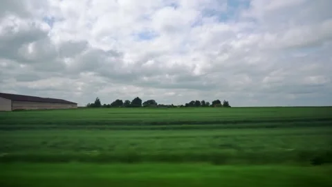 Meadows fields, farm. Warehouses on background. Highway along storage facilities Stock-Footage 253471924