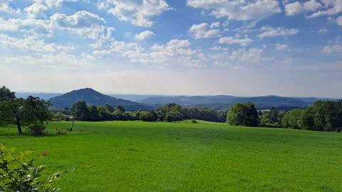 Meadows with forests in spring and summer Stock Photos