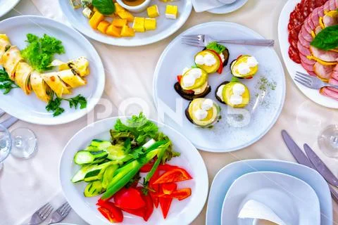 Meal at the banquet. good cuts of meat, cheese. the holiday table Stock Photos