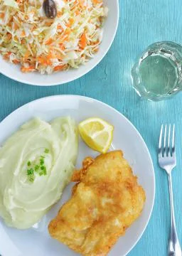 Meal with dish of bread crumbed cod fish and garlic dip, known as skordalia, Stock Photos