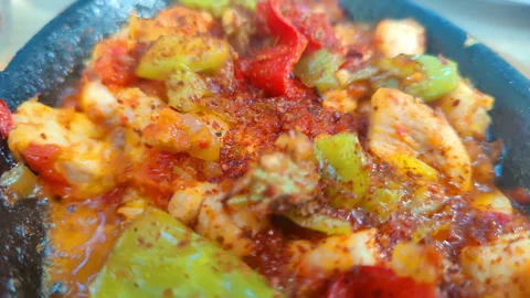 Meal Made with Chicken and Vegetables Cooks in a Clay Plate Stock Footage 284674924