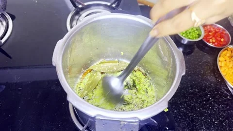 Meal preps begin in a cooker using natural element Stock Footage 313277076