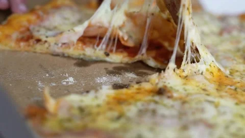 Meal time at pizzeria, man taking a slice of the pizza shot with very thin depth Stock-Footage 336586685